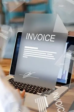 Banking invoice payment process on a laptop during daytime at a workspace Stock Photos