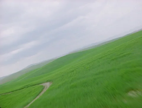 Banking over lush green fields aerials 1989 Video stock 136070766