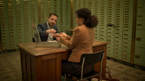 Banking security uses vaults, boxes, and client interactions to protect Stock Footage 276583370