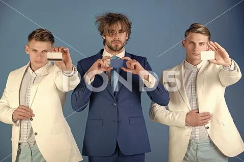 Banking services. Businessmen showing visiting and bank cards Stock Photos