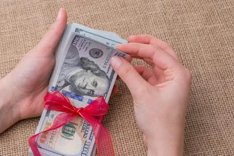 Banknote bundle of US dollar tied with a ribbon Stock-Fotos