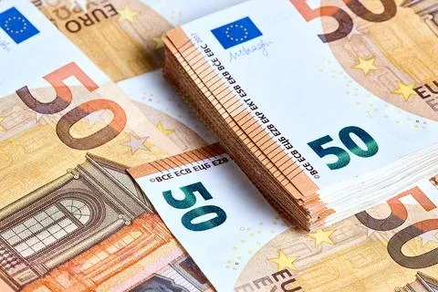 Banknotes 50 euro. Stack of new 2017 fifty Euro banknotes lays on a haphazard Stock Photos