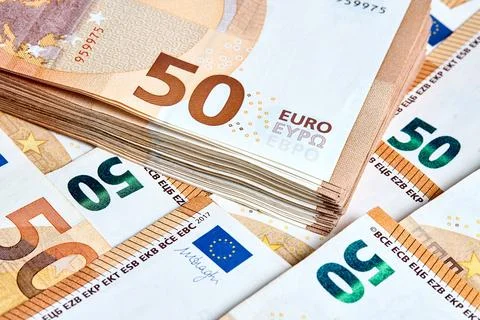 Banknotes 50 euro. Stack of new 2017 fifty Euro banknotes lays on a haphazard Stock Photos