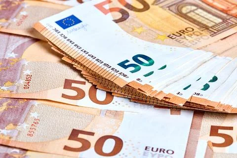 Banknotes 50 euro. Stack of new 2017 fifty Euro banknotes lays on a haphazard Stock Photos