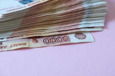 Banknotes 5000 banknotes on a pink background. Stock Photos