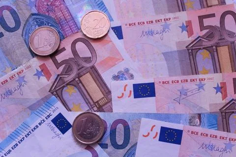 Banknotes and coins Stock Photos