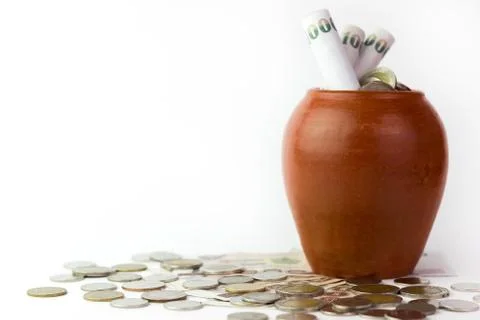 Banknotes are rolled into pot. Stock Photos