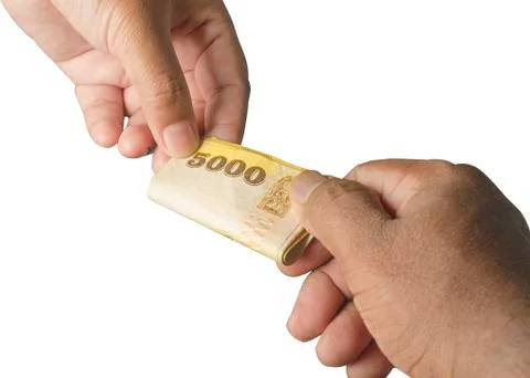 Banknotes being given and received showing hand movement. on white isolated b 스톡 사진