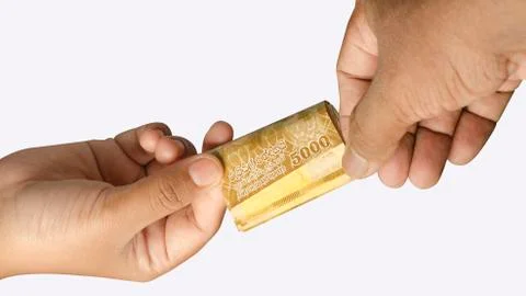 Banknotes being given and received showing hand movement. on white isolated b Stock Photos