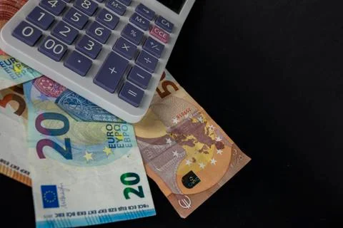 Banknotes with calculator for counting Stock Photos