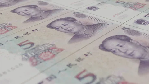 Banknotes from China featuring Mao Zedong emerge from printing machine Stock Footage 310599859