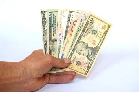 Banknotes of different countries and denominations fan in hand. 스톡 사진