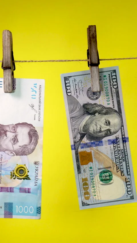 Banknotes of different countries dry on a clothespin rope Stock Footage 324949431