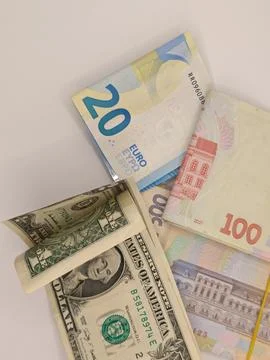 Banknotes of different countries on the table Stock Photos