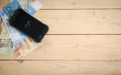 Banknotes different countries on the wooden table Stock Photos