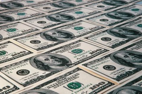 Banknotes of dollars are stacked in a row. Stock Photos