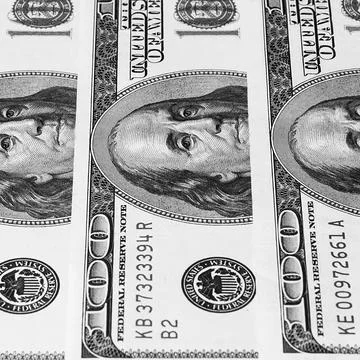 Banknotes of dollars are stacked in a row. Stock Photos