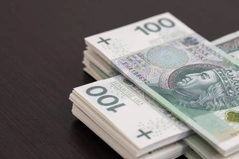 Banknotes evenly distributed on a dark brown desk ready for use. Collectio... Fotos Stock