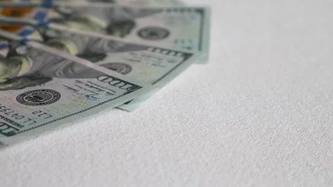 Banknotes of hundred dollars on a white background Stock Photos