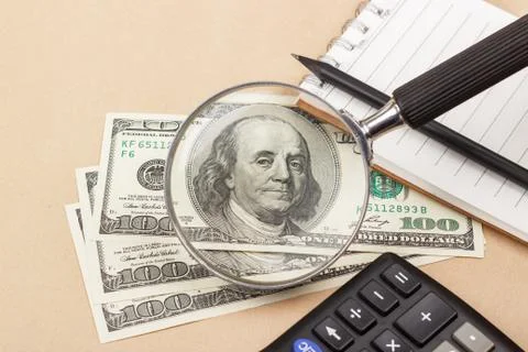 Banknotes, notepad, calculator Stock Photos