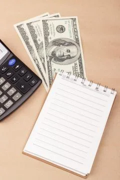 Banknotes, notepad, calculator Stock Photos