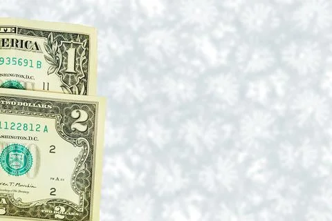 Banknotes of one two dollars on grey spotted backdrop Ilustração Stock