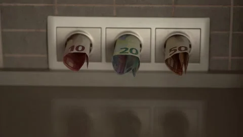 Banknotes rolls stick out of socket on wall in kitchen Stock Footage 246146484