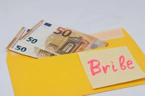 Banknotes in a yellow envelope on a light background. envelope with banknotes Stock Photos