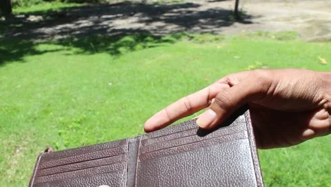 A bankrupt man shows an empty wallet without money. Poverty financing business Stock Footage 284738832