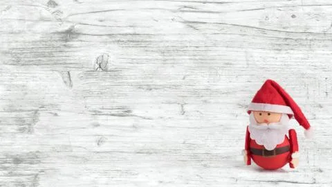 Banner, backdrop or background with a cute Santa Claus Doll with copy space.  Stock Photos