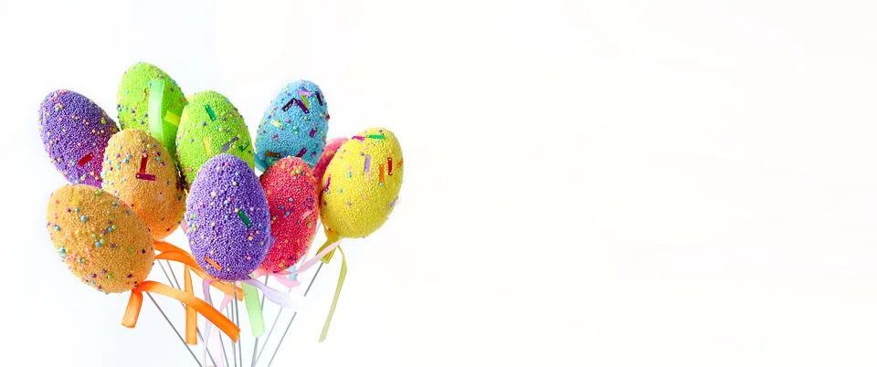 Banner of bright multi-colored Easter eggs isolated on white background Stock Photos