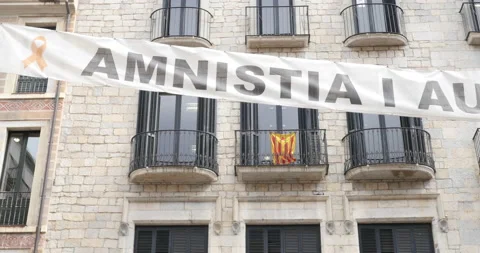 Banner calling for amnesty and self-determination in the Catalan city of Girona Stock Footage 210461566