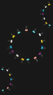 Banner circle of multi-colored paper clips with copy space in middle on black Stock Photos