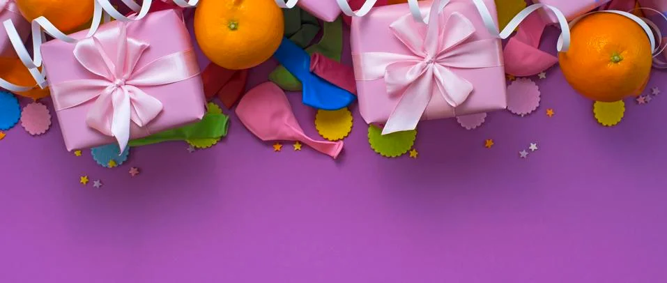 Banner Decorative composition Three boxes with gifts Satin ribbon Bow Oranges Stock Photos