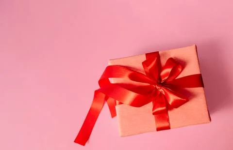 Banner design with present box and hearts on pink background. Stock Photos