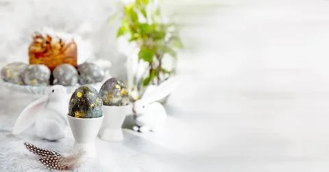 Banner. Easter eggs with gold pattern. A plate with Easter eggs and bunny Stock Photos