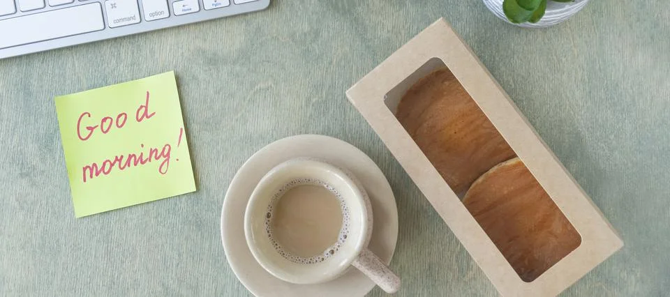 Banner with flat lay with of the desktop. note with the words GOOD MORNING, p Stock Photos
