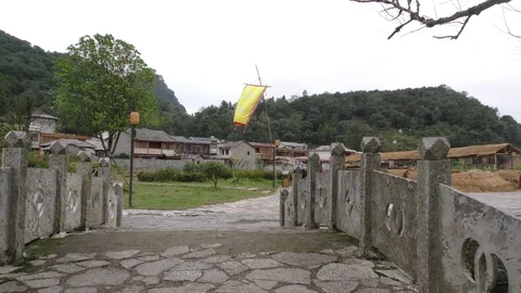 Banner Flying over bridge Ancient Tunpu Village China Stock Footage 73912002