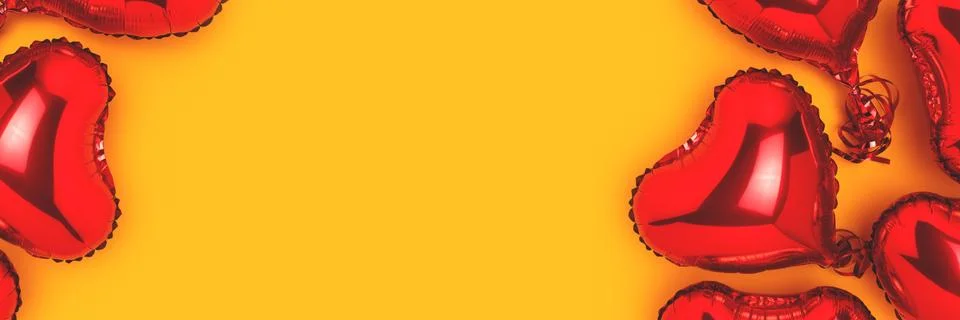 Banner with frame made of red inflatable foil balloons in a heart shape. Stock Photos