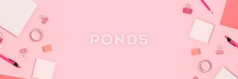 Banner with frame made of stationery on a pink pastel background. Stock Photos