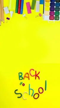 Banner letters made of multi-colored plasticine back to school in funny style on Stock Photos