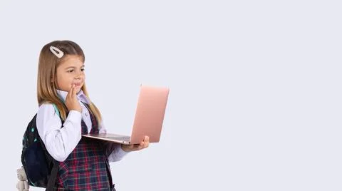 Banner- long format. Online lessons. An elementary school student in uniform  Photos