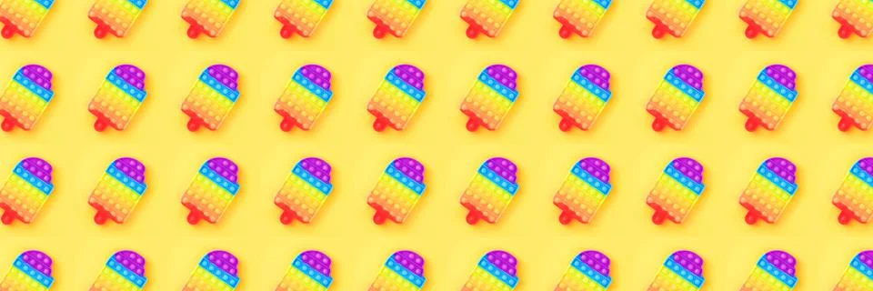 Banner made from pattern with pop it toy isolated on yellow background. Stock Photos