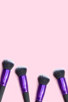 Banner with makeup brushes on a pink background. Place for text. Copy space.  Stock Photos