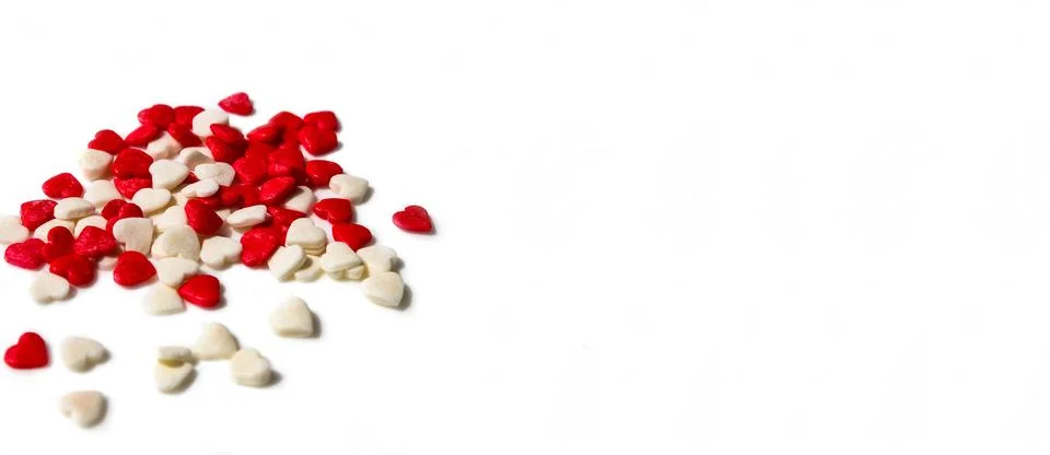 Banner of many small white and red hearts on a white isolated background Stock Photos