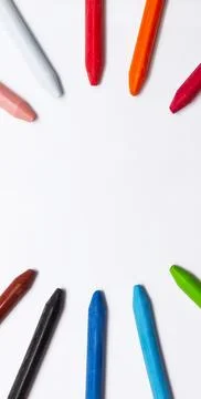 Banner multicolored crayons lie in shape of circle on white background Stock Photos