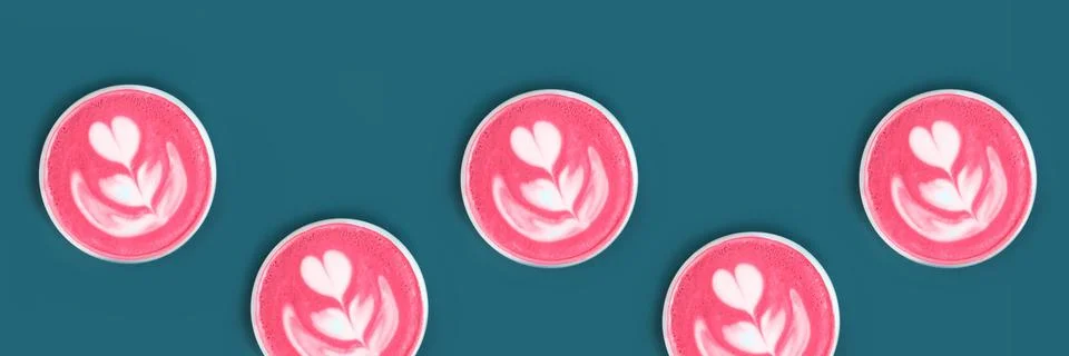 Banner with pattern with cup of trendy beetroot latte on table. Stock Photos