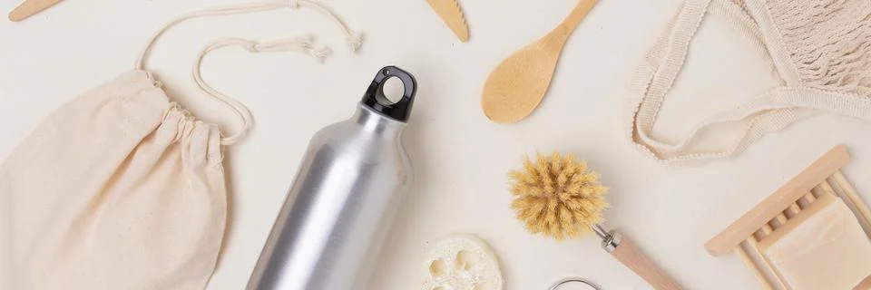 Banner with pattern made of zero waste items on a beige background. Stock Photos