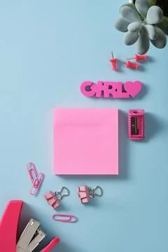 Banner of pink post-it notes and office supplies stapler, paper clips, sharpe Stock Photos
