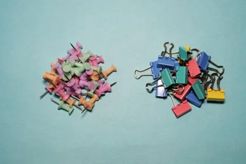 Banner plastic head push pins thumbtacks isolated on blue background. Stock Photos